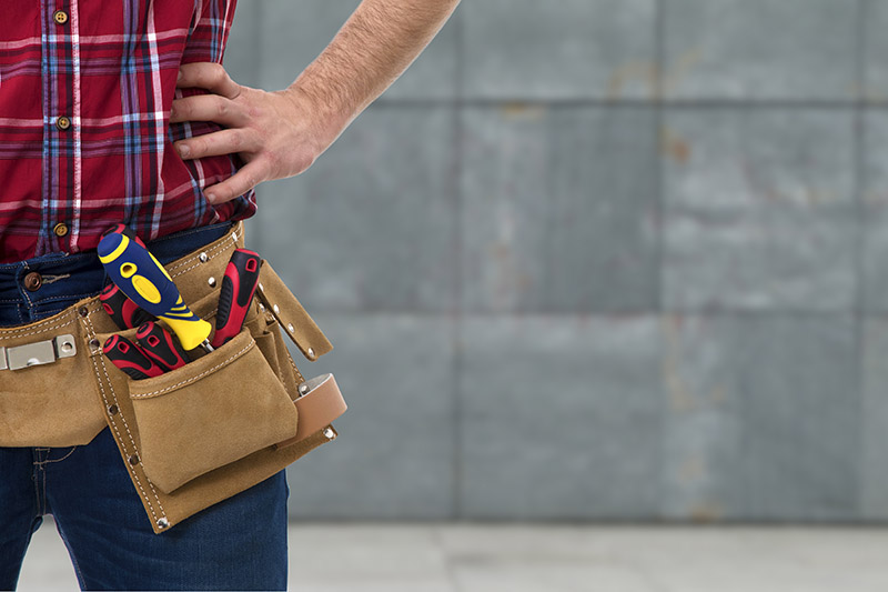 Person standing with tool belt slightly out of frame on the right